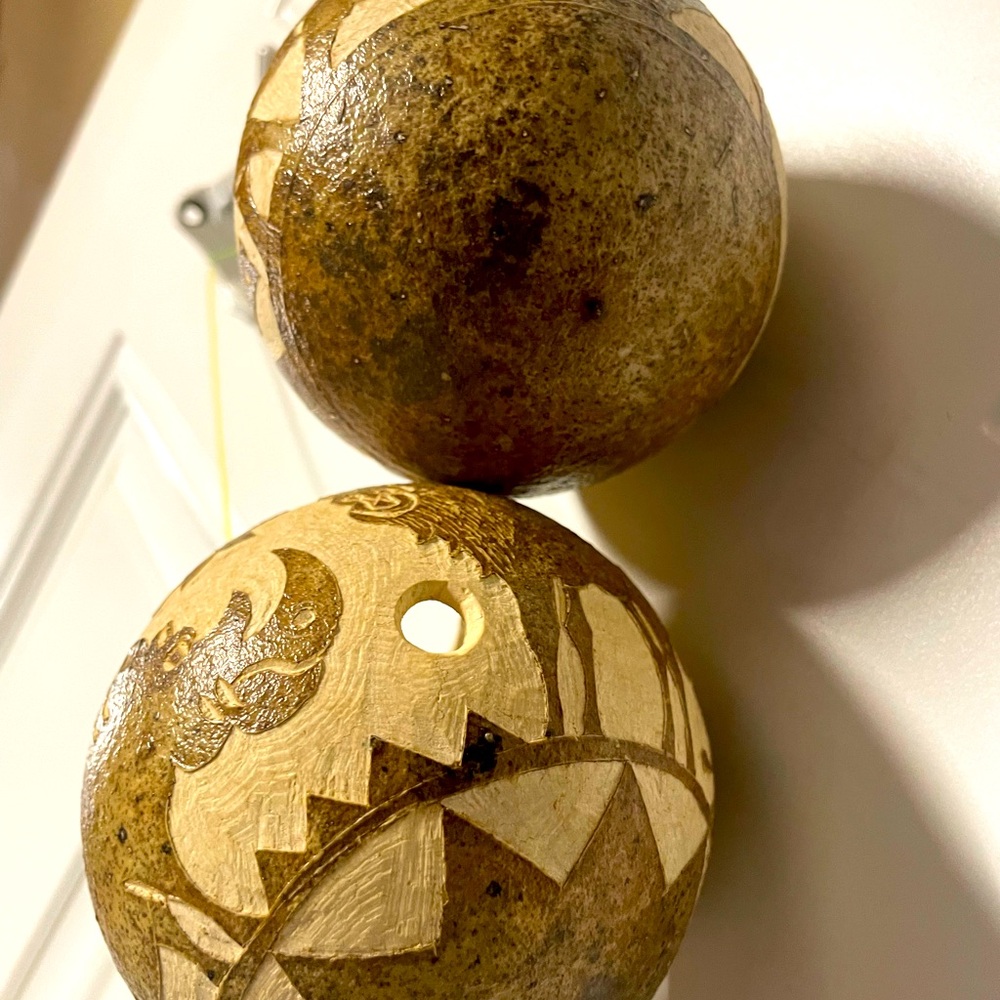 Hand carved gourd ornaments x2. AFRICA and has animals as in pic.